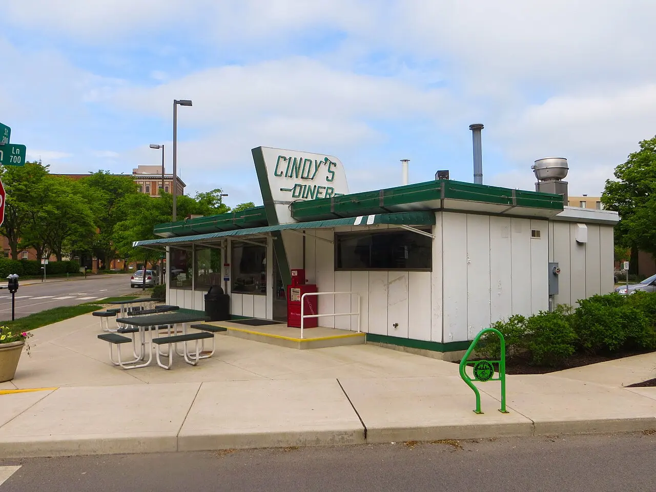 Cindy’s Diner in Fort Wayne, with its green trim and outdoor picnic tables, photographed in 2018.