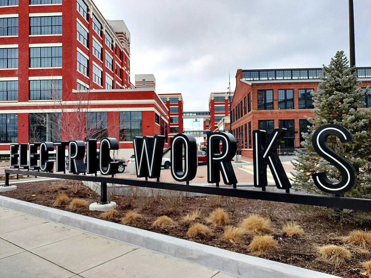 Electric Works sign in front of the red brick former factory buildings.